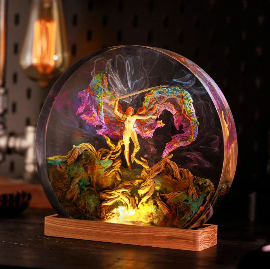 Mystical Elden Ring LED orb lamp showcasing vibrant fantasy scene. Handcrafted lantern with swirling colors and golden figure, inspired by game's ethereal messages. Unique illuminated decor for gamers and collectors seeking authentic Lands Between ambiance.