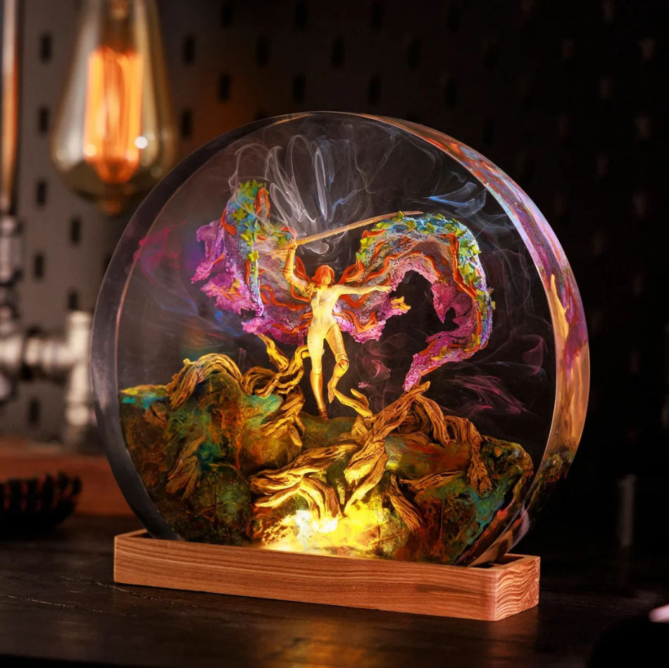 Elden Ring Message LED Lamp featuring a glowing orb with swirling colors and golden figure, illuminated on wooden base. Unique fantasy lantern inspired by Elden Ring game, perfect for atmospheric lighting and gaming decor.