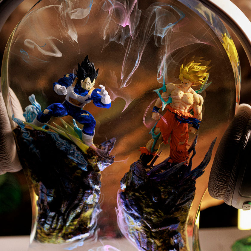 Illuminated Dragon Ball Z headphone stand with Goku and Vegeta figures, combining lamp and audio accessory  Copy Retry