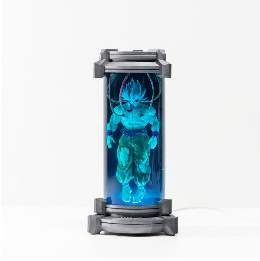 Futuristic Goku Spirit Bomb Lamp - Dragon Ball Z character encased in luminous blue cylinder, anime-inspired LED night light