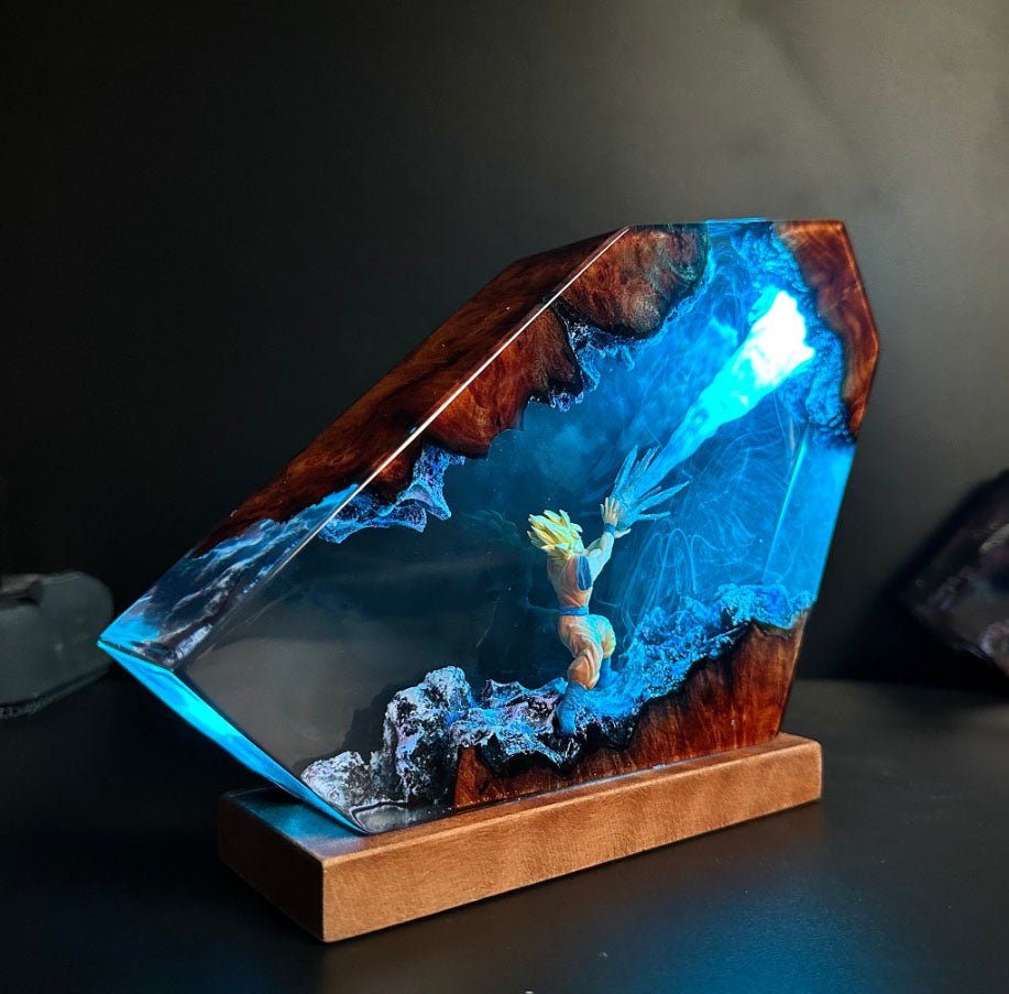 Illuminated Goku lamp featuring Kamehameha attack with Blue Light. Dragon Ball Z resin sculpture with glowing energy beam. Unique side-view design of Spirit Bomb-like effect in Dragon lamp form.