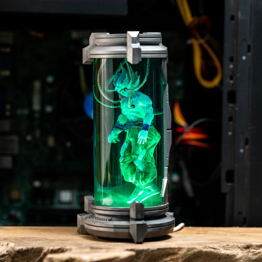 Goku Lamp: Illuminated Dragon Ball Z figurine floating in blue energy cylinder, sci-fi inspired anime night light collectible