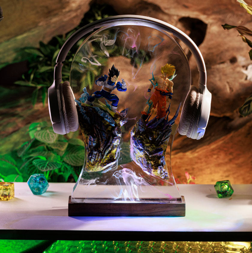 Goku headphone stand with Dragon Ball Z lamp featuring Goku and Vegeta resin figures, illuminated by colorful LEDs