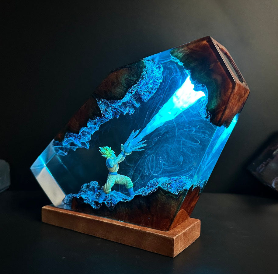 Illuminated Goku lamp featuring Kamehameha attack with Blue Light. Dragon Ball Z resin sculpture with glowing energy beam. Unique side-view design of Spirit Bomb-like effect in Dragon lamp form.