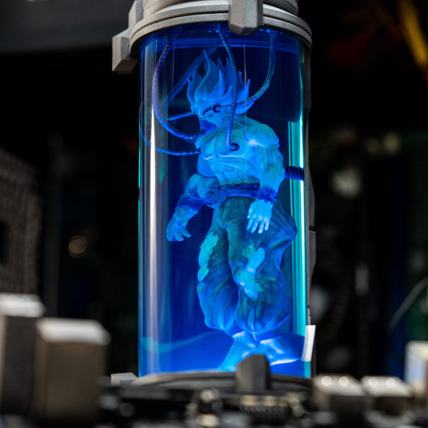 Dragon Ball Z night light - Glowing blue Goku figure suspended in cylindrical resin lamp, anime-inspired collectible illumination